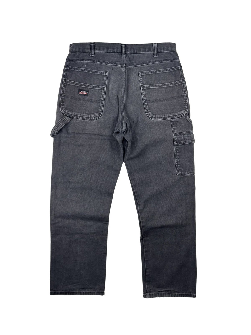 Vintage Dickies Carpenter-Hose in der Rückansicht. Ausgewaschene, anthrazit-schwarze Workwear-Hose mit klassischen aufgesetzten Taschen und Hammerschlaufe.