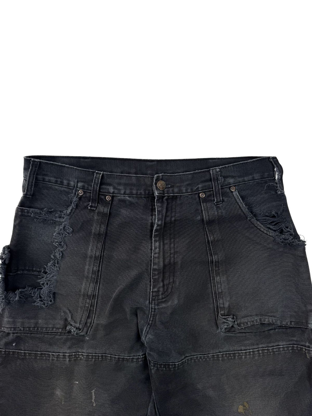 Nahaufnahme vom Bund und den vorderen Taschen einer Dickies Hose mit extremen Ausfransungen und Heavy-Distressing.