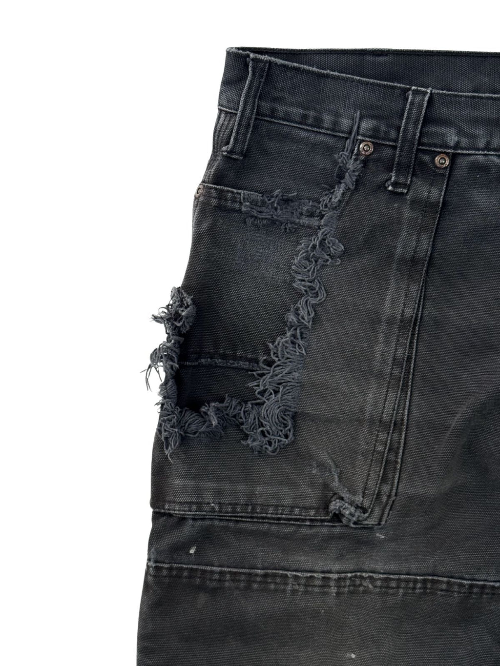 Extreme Abnutzung und Löcher an der rechten Tasche einer schwarzen Vintage Dickies Double Knee.
