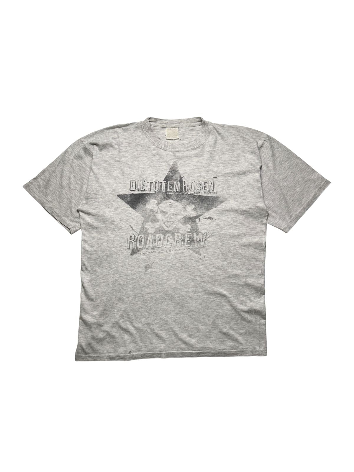 Originales Vintage Die Toten Hosen Roadcrew Shirt von der „Ewig währt am längsten“ Tour 1996. Graumeliertes Punkrock T-Shirt in der Frontansicht mit verwaschenem Stern- und Totenkopf-Print.