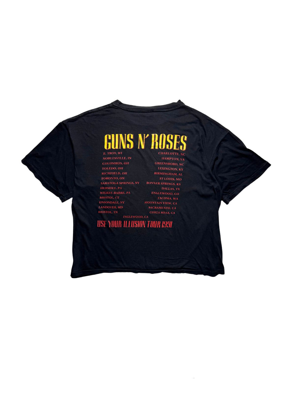 Rückseite des schwarzen Guns N’ Roses Vintage-Shirts von 1991 in der Gesamtansicht mit gelb-rotem Backprint der US-Tourdaten.