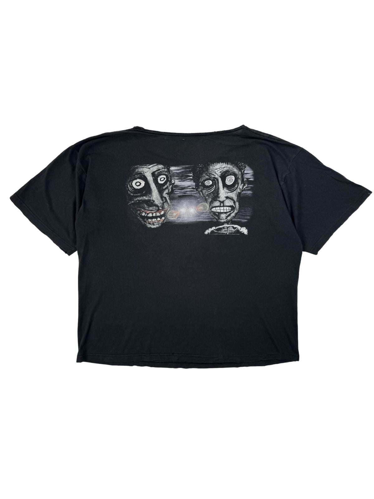 Rückseite des schwarzen Vintage Primus Band-Shirts von 1995 mit einem surrealistischen Grafik-Print zweier Gesichter.